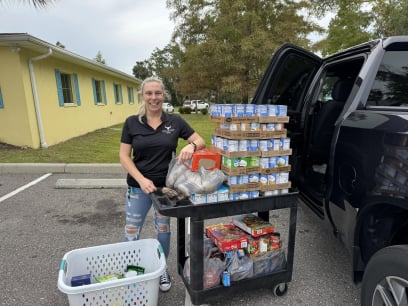 Erica unloading a truck of donated food and drinks