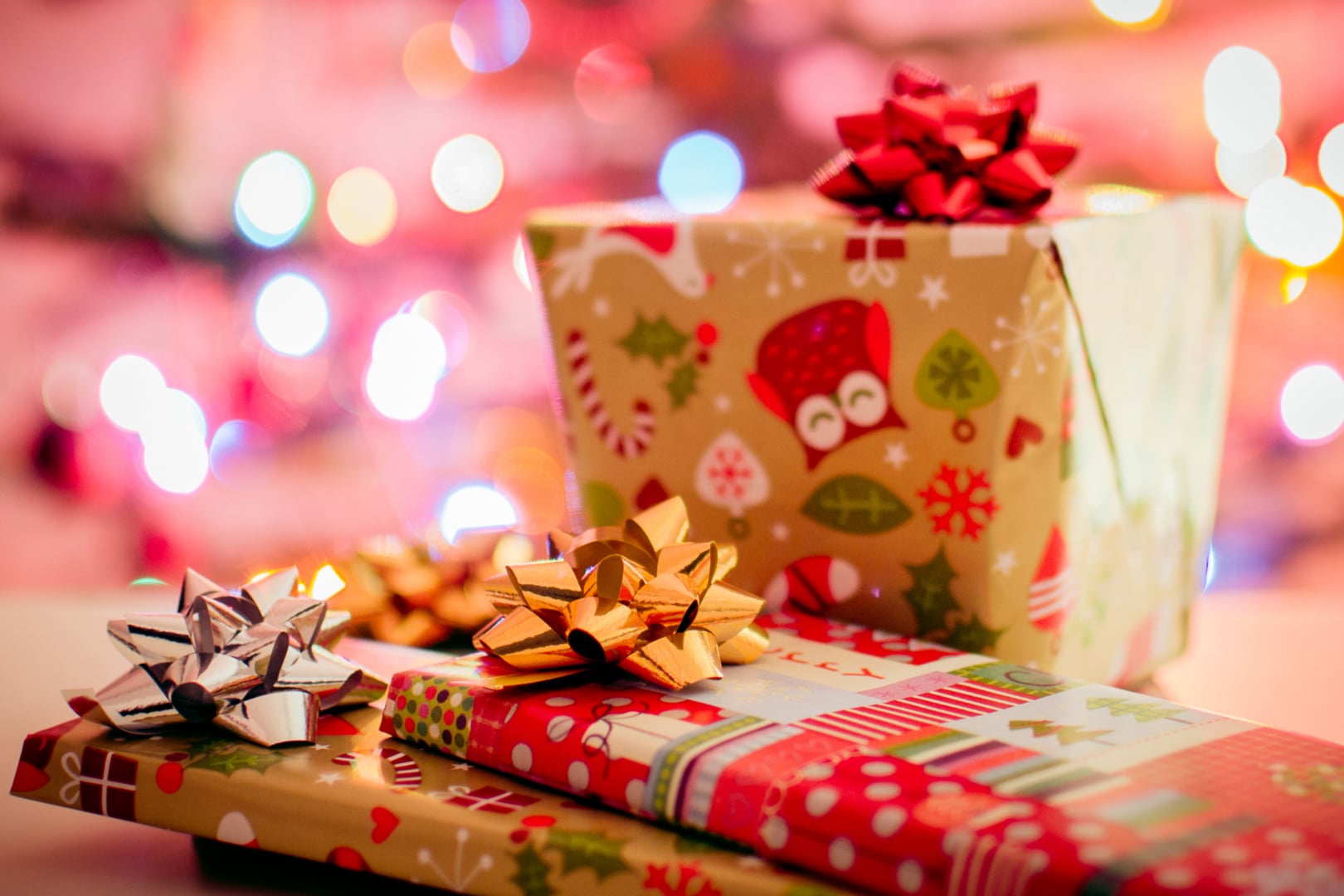 christmas grifts wrapped in brown and red paper and bows