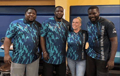 Erica with the Nobel Blowing Team in teal and black matching shirts